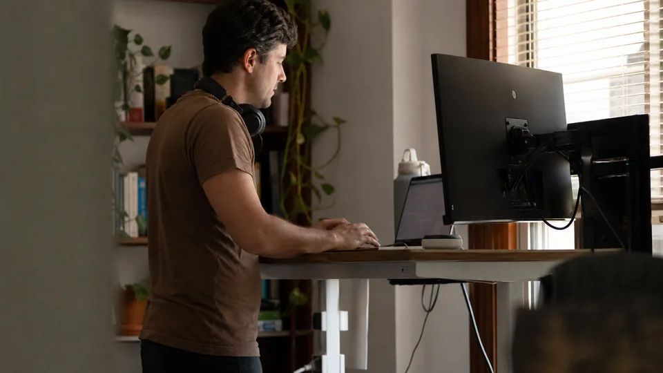 Instructional designer building a course at a standing desk